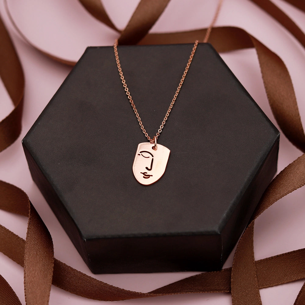 Elevate your style with the Silent Face Necklace. Featuring a sleek, minimalist face pendant, this premium necklace adds a touch of modern elegance to any look. Perfect for everyday wear or special occasions