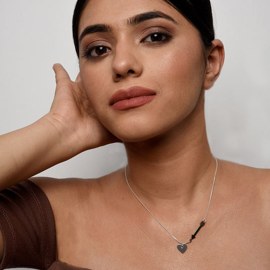 Cupid's Heart and Arrow Necklace with delicate heart and arrow pendant on a fine chain